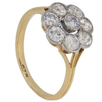 An early 20th century, 18ct yellow gold, diamond set, nine stone daisy cluster ring.