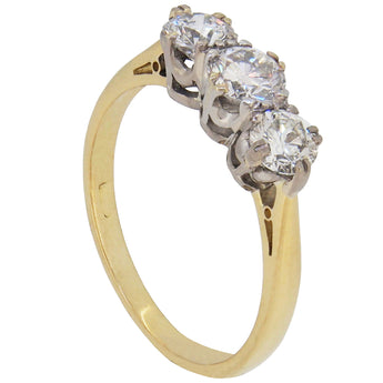A modern, 18ct yellow gold & platinum setting, diamond set three stone ring