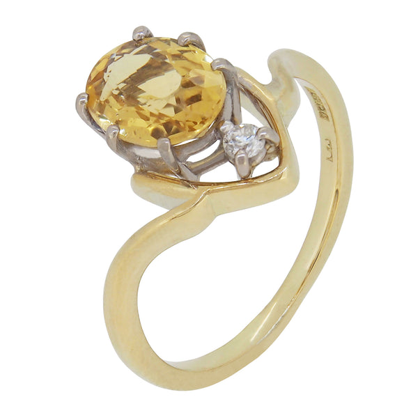 A modern, 18ct yellow gold, yellow beryl & diamond set two stone ring