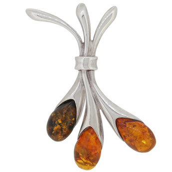 A modern, silver, amber set, three stone pendant