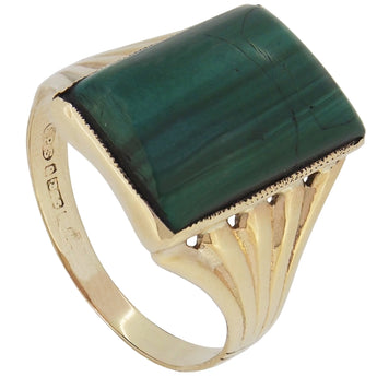 A modern, 9ct yellow gold, malachite set single stone ring.