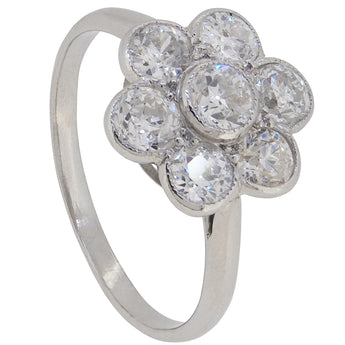 A mid-20th century, platinum, diamond set, daisy cluster ring.