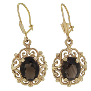 A pair of modern, 9ct yellow gold, smoky citrine set drop earrings.