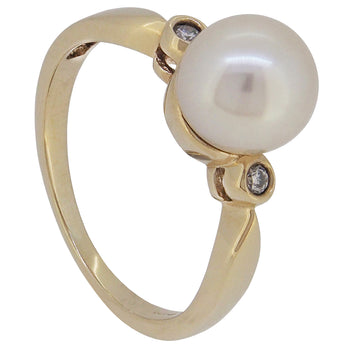 A modern, yellow gold, pearl & diamond set three stone ring.