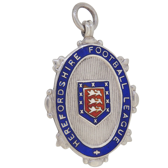 An early 20th century, silver & enamel set, Hereford Football League medal