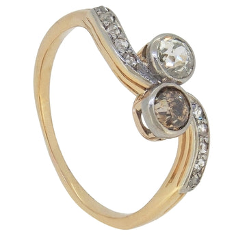 An early 20th century, yellow gold, white & champagne diamond set crossover ring.