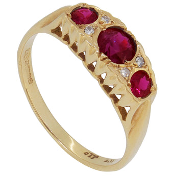 An early 20th century, 18ct yellow gold, ruby & diamond set, seven stone ring.