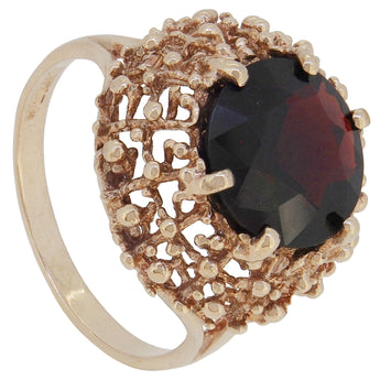 A modern, 9ct yellow gold, garnet set single stone ring.