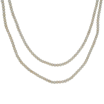 An early 20th century, two row cultured pearl necklet with an 18ct white gold, diamond set, three stone snap.