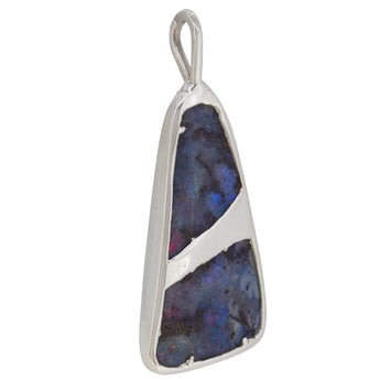 A modern, silver, boulder opal set abstract brooch.