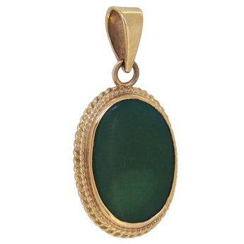 A mid-20th century, 9ct yellow gold, green turquoise set pendant with a cord border.