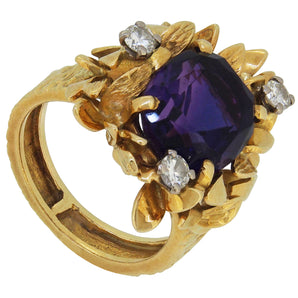 A modern, 18ct yellow gold, amethyst & diamond set four stone abstract ring.