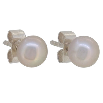 A pair of modern, silver, pearl set stud earrings.