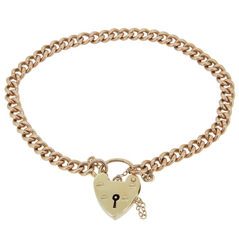 An early 20th century, 9ct yellow gold, solid curb link bracelet with a padlock clasp.
