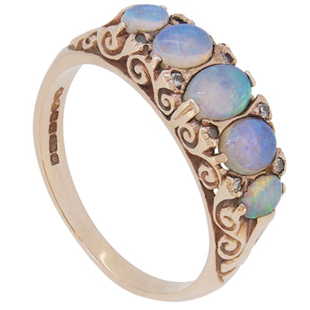 A modern, 9ct yellow gold, opal & diamond set carved half hoop ring.