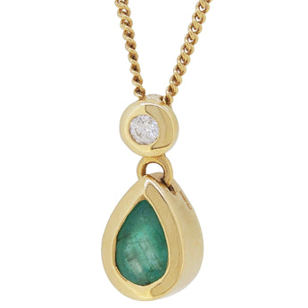 A modern, 18ct yellow gold, emerald & diamond set pendant & chain.
