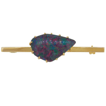 A modern, 9ct yellow gold, opal triplet set bar brooch.