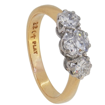 An early 20th century, 22ct & platinum, old fashioned brilliant cut diamond set three stone ring.