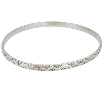 A modern, silver patterned bangle.
