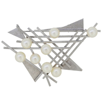 A mid-20th century, silver, cultured pearl set abstract brooch.