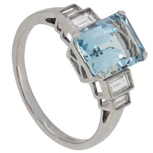 A modern, 18ct white gold, aquamarine & diamond set five stone ring.
