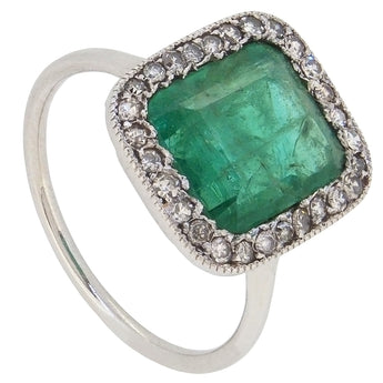 An early 20th century, platinum, emerald & diamond set, Art Deco style, oblong cluster ring.