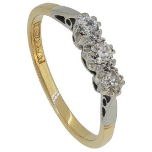 An early 20th century, 18cty yellow gold & platinum, diamond set three stone ring.