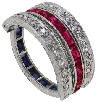 A mid-20th century, platinum, ruby, sapphire & diamond set reversible ring.