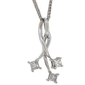 A modern, 18ct white gold, princess cut diamond set, three stone pendant & chain.