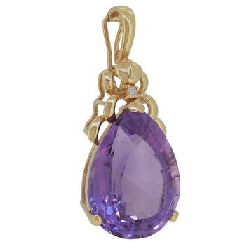 A modern, 14ct yellow gold, pear cut amethyst & diamond set pendant.