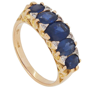 A modern, 18ct yellow gold, sapphire & diamond set, thirteen stone, carved half hoop ring.