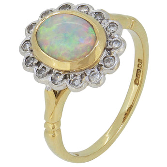 A modern, 18ct yellow gold, opal & diamond set, oval cluster ring.