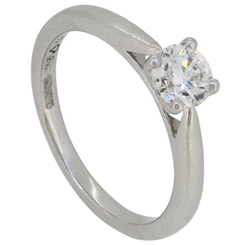 A modern, platinum, diamond set single stone ring.