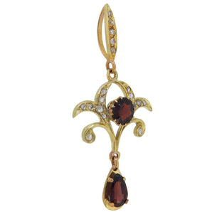 A mid-20th century, 9ct yellow gold, garnet & diamond set open work pendant.