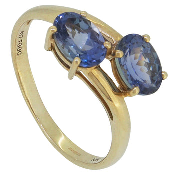 A modern, 9ct yellow gold, tanzanite set, two stone crossover ring.