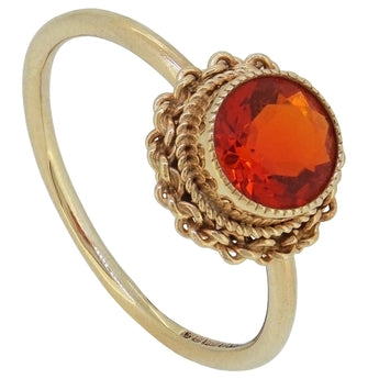 A modern, 9ct yellow gold, fire opal set single stone with a cord border.