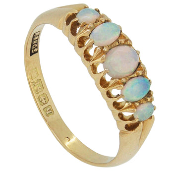 An Edwardian, 9ct yellow gold, opal set, five stone half hoop ring.