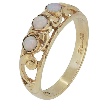 A modern, 9ct yellow gold, opal set three stone ring.