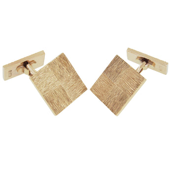 A pair of mid-20th century, 9ct yellow gold, bar link, swivel toggle square cufflinks with a tree bark texture engraving.