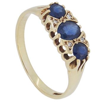 A modern, 9ct yellow gold sapphire & diamond sat, seven stone half hoop ring.