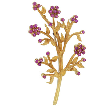 A modern, 18ct yellow gold, ruby set spray brooch.
