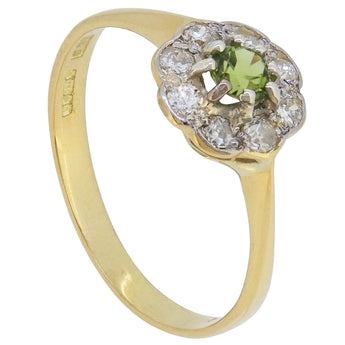 A modern, 18ct yellow gold, peridot & diamond set, nine stone, daisy cluster ring.