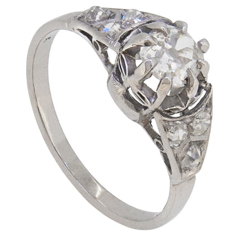 An early 20th century, 18ct white gold, diamond set, Art Deco style, seven stone ring.
