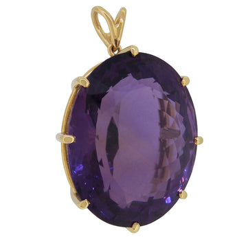 A modern, 9ct yellow gold, amethyst set pendant.