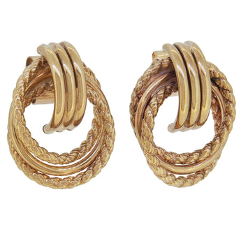 A pair of modern, 9ct yellow gold, intertwined hoop earrings.