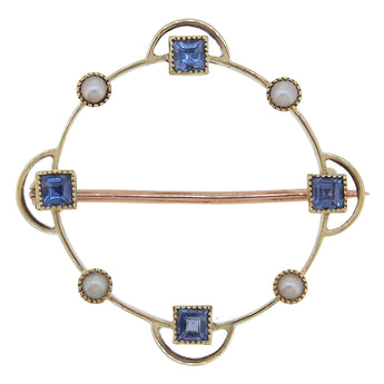 An early 20th century, 18ct yellow gold, sapphire & pearl set circular brooch.