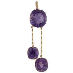 An Edwardian, 15ct yellow gold, amethyst set, three stone pendant.