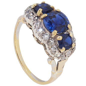 An early 20th century, 18ct gold, sapphire & diamond set triple cluster ring.