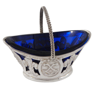 An Edwardian, silver, pierced oval sweet basket with a blue glass liner.
