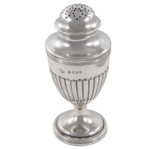 A Victorian, silver, fluted pepper pot on a pedestal foot.